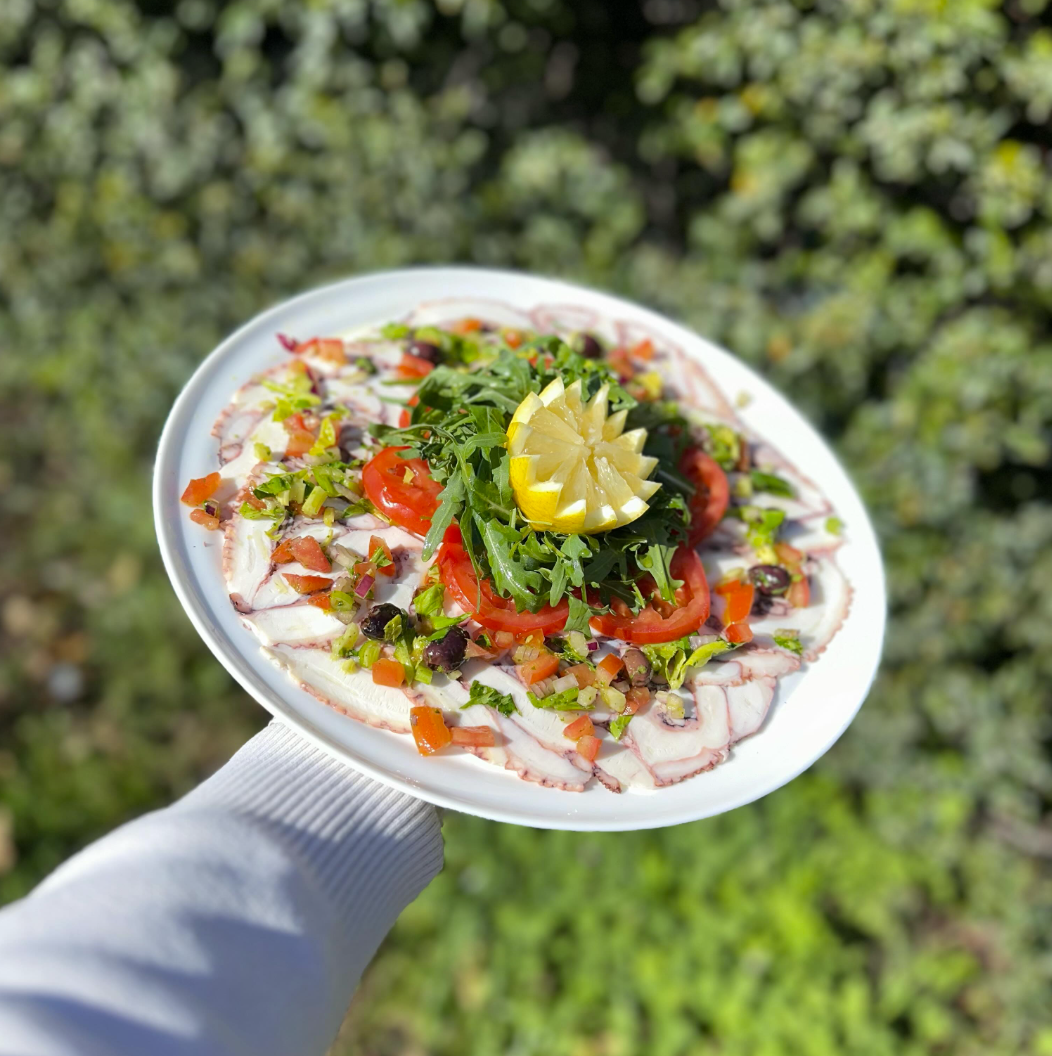 Carpaccio de poulpe mariné aux herbes